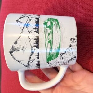 2018 Tim Hortons Green Boat on Lake Mountains Mug